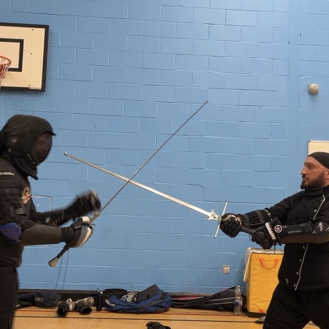 Olgun Tiltay learning Longsword techniques from Cosmas Cieplak-Mayr von Baldegg HEMA instructor in Ausardia Olgun Tiltay learning Longsword techniques from Cosmas Cieplak-Mayr von Baldegg HEMA instructor in Ausardia